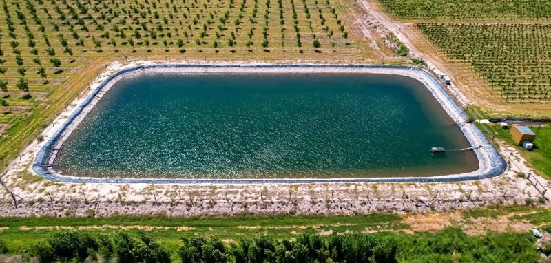 Farm water harvesting pond liner installation - Khet Talavadi