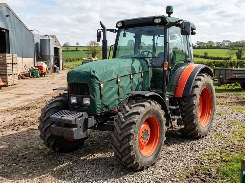 Agricultural tractor fitted with protective waterproof hood cover